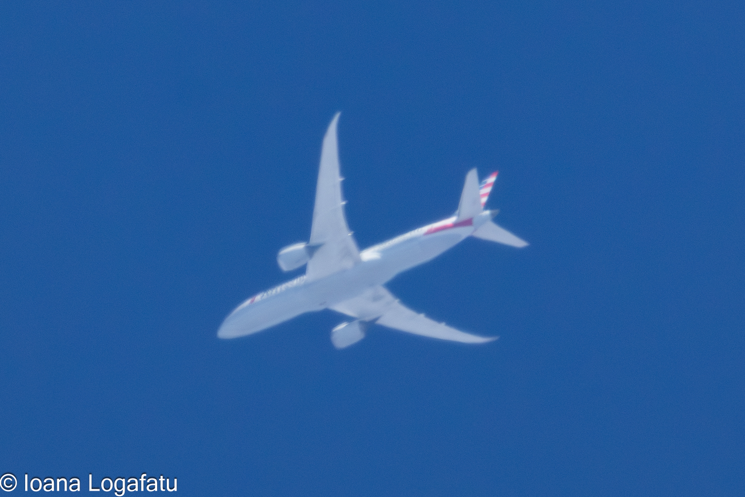 Airplane gliding gracefully across a clear sky